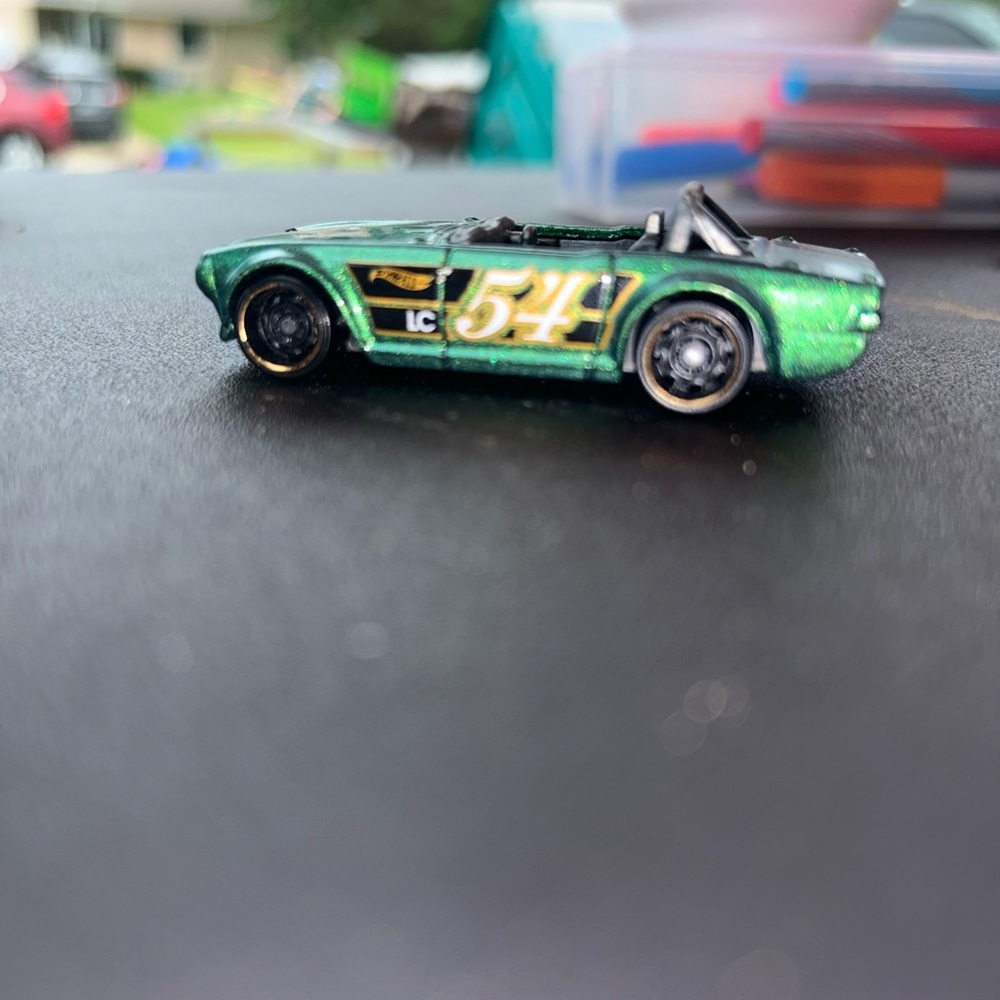 Hot wheels, triumph TR6 (Green with 54 on door) 1/10 HW race day